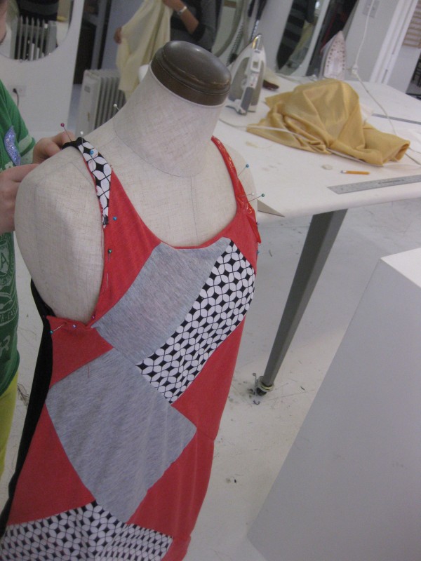 Setting the neckline of her bias-cut tank.