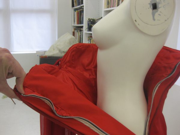 And then, of course, it fails only when the zipper is entirely down. If you look closely, you can see the construction details of the layers. This is our preferred way to build any corseted dress or gown, but especially a strapless one. 