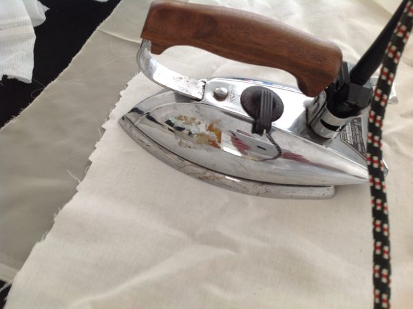 Our favorite and most used iron in action at tchad workroom sewing classes in chicago
