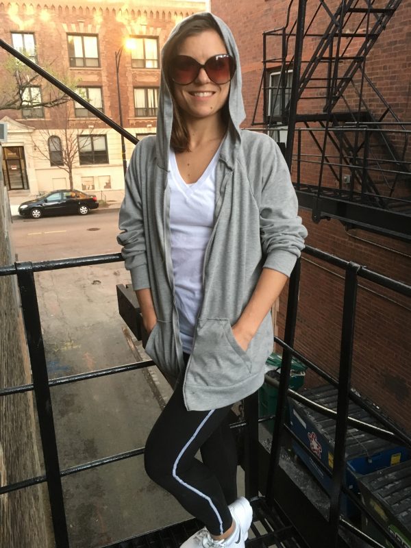Jae on the fire escape at Tchad workroom enjoying her first hoodie.