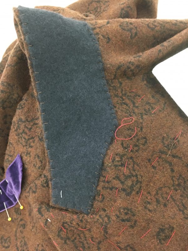 Mark stays the gorge line of his jacket with velvet ribbon at Tchad workrooms