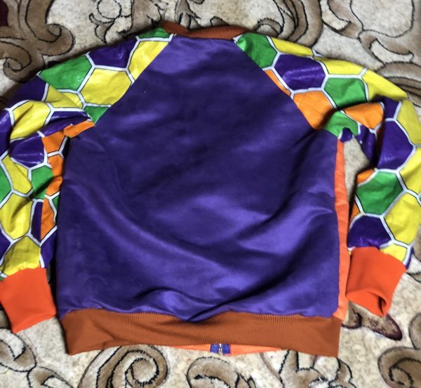 Back view of Lamel's bomber jacket in various satins with orange cotton ribbing