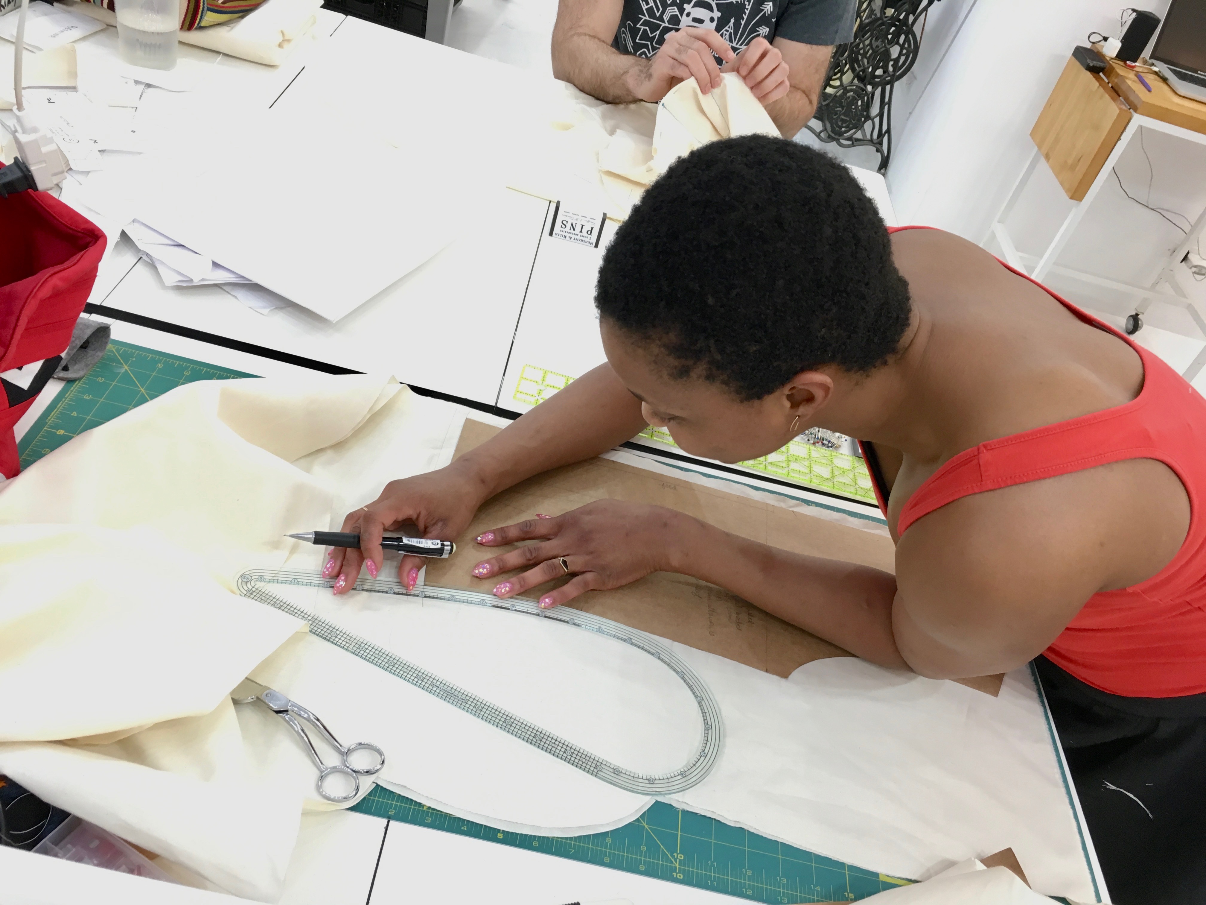 Sewing classes in Chicago: Omoleye alters her pattern at the Tchad workroom in Chicago.