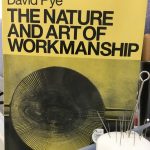 A photograph of David Pye's seminal book The Nature and Art of Workmanship photographed at the Tchad Workroom library in Chicago that hosts sewing classes in Chicago