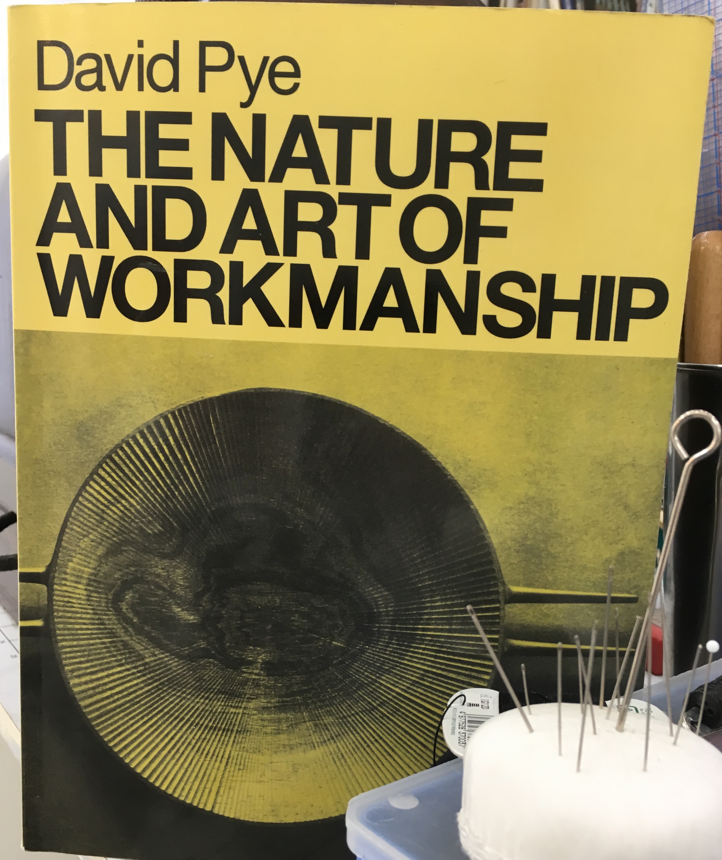 A photograph of David Pye's seminal book The Nature and Art of Workmanship photographed at the Tchad Workroom library in Chicago that hosts sewing classes in Chicago